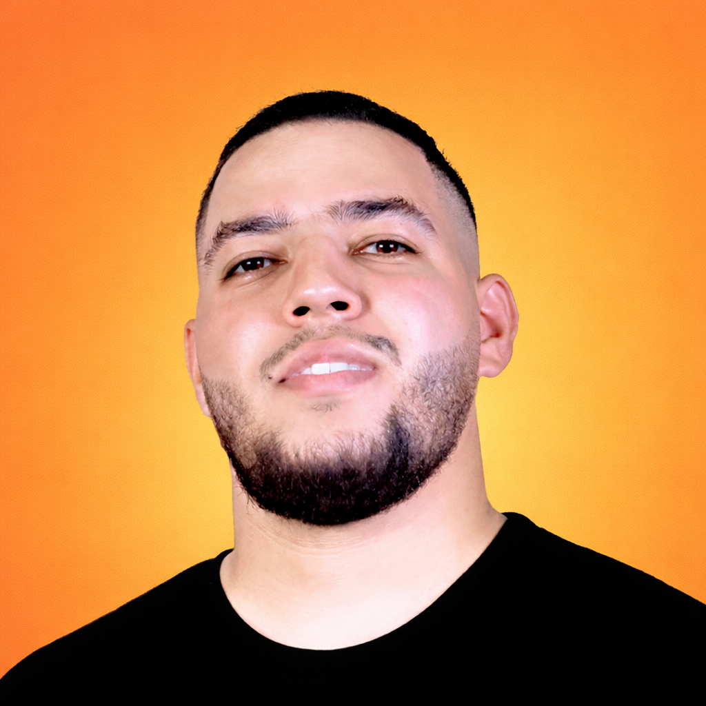 Gammi wearing a black shirt against an orange background
